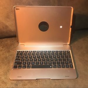Rose-Gold iPad case with foldable keyboard.